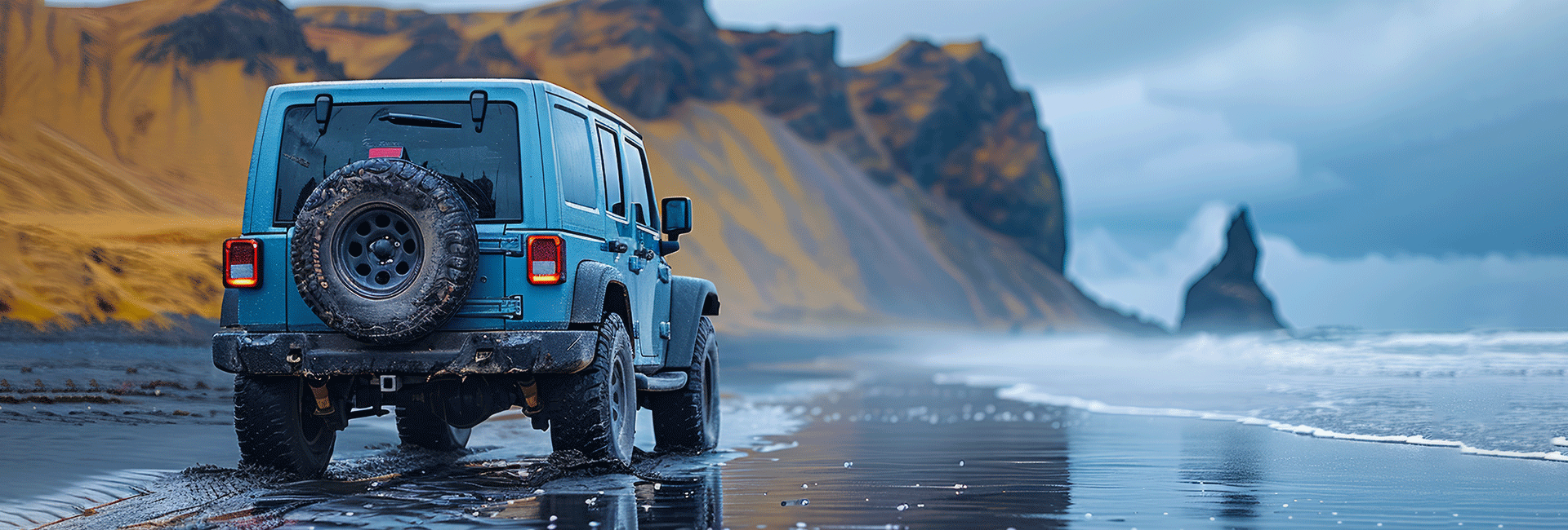 Jeep at the beach driving through the sand