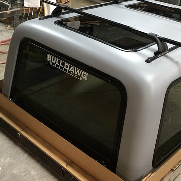 Bull Dawg hardtop on a cardboard box with a warehouse background