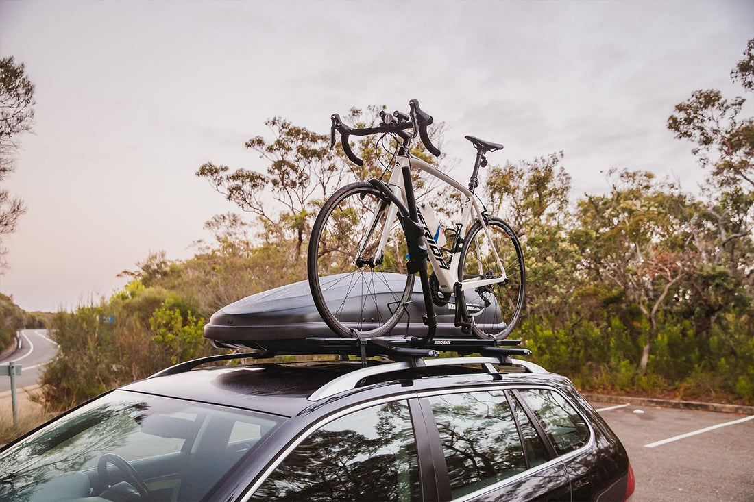 car with cycling rhino rack kit mouted on top