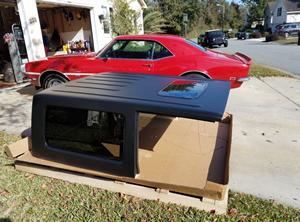 black jeep hardtop with side window and sunroof